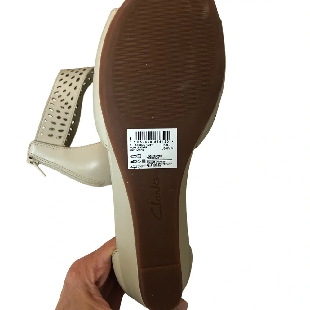 Collection by Clark’s. Abigail Ruby in Ivory. Perforated leather‎ wedges. 8.5